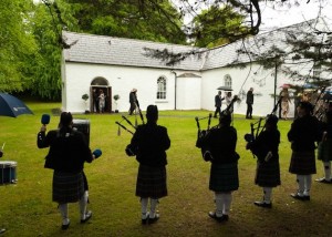 Pipers Outside Church